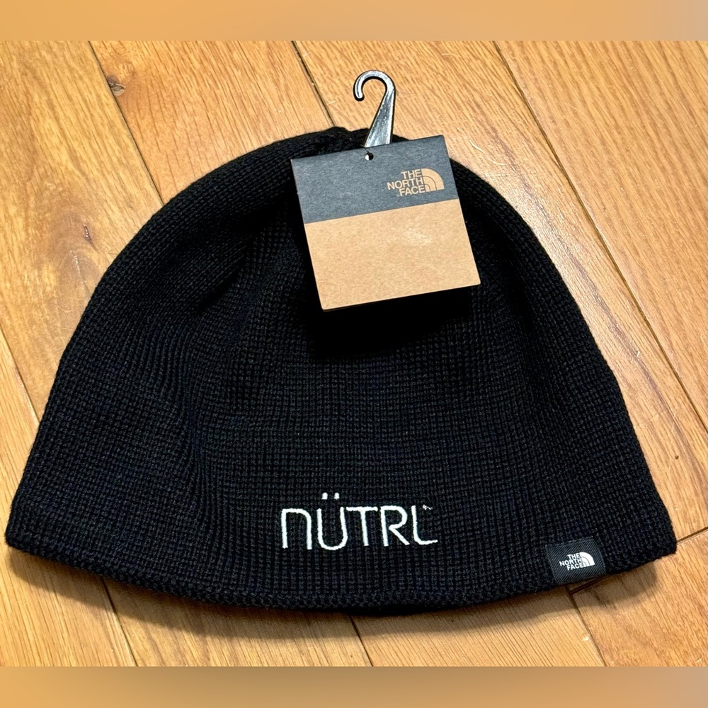 The North Face TNF Black Mountain Beanie Hat, fleece-lined interior. One size
